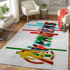 a living room area with a white rug and colorful artwork on the floor next to two chairs