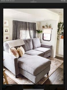 a couch and ottoman in a small living room