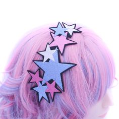 Illuminate your style with our Multi Star Burst Headband, a celestial accessory that adds a touch of sparkle to any outfit. This headband features an array of embroidered stars in various sizes and vibrant colors, including blue, pink, and white. Each star is meticulously crafted using the highest quality threads, bringing the design drawn and digitized by me to life with stunning detail and brilliance. Designed for comfort and versatility, the headband has a black elastic cord securely sewn to the back, ensuring a perfect fit for any head size. Handmade with love in my studio, this headband is a testament to fine craftsmanship and unique design. Perfect for adding a whimsical touch to your everyday look or for special occasions, this Multi Star Burst Headband is a versatile accessory that Bachelorette Party Accessories, Womens Headband, Celestial Stars, Embroidered Stars, Star Headband, Star Burst, Festival Accessories, Booth Props, Girls Gift