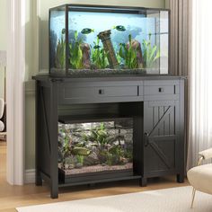 a fish tank sitting on top of a wooden table