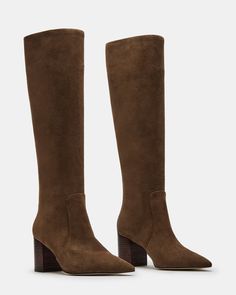 Elevate your style with the SKYLINE knee-high boots. These boots feature a sleek pointed-toe design and a sturdy block heel, providing both fashion and comfort. Made with high-quality materials, they are sure to be a staple in your wardrobe for years to come. 2.5 inch heel height Size 6 measurements: 15.25 inch shaft circumference, 15.75 inch shaft height Size 8 measurements: 16 inch shaft circumference, 16.25 inch shaft height Size 10 measurements: 16.75 inch shaft circumference, 16.75 inch sha Brown Knee High Boots Outfit, Brown Knee High Boots, Brown Suede Boots, Suede Boots Knee High, Toe Designs, Elevate Your Style, Suede Boots