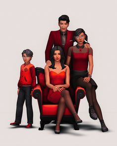 three people are sitting on a red chair with their arms around each other while the man is standing behind them