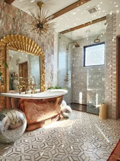 a bathroom with a gold bathtub and mirror