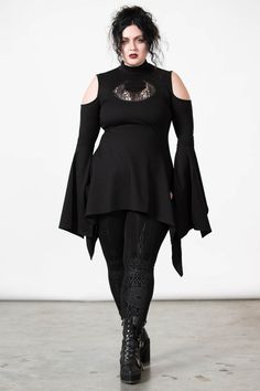 MOONSHINE.- Soft, super stretch fabric.- Statement crescent moon lace cut-out.- Cold shoulder.- High neck.- Hanky hem.- Long line.- Button closure.Model is 5ft 5 and wears a size L.with KILLSTAR branding, 60% Rayon, 35% Nylon, 5% Elastane. Plus Size Rogue Cosplay, Whimsical Goth Fashion Plus Size, Casual Romantic Goth, Adult Goth Fashion, Plus Size Witch Fashion, Plus Size Gothic Fashion, Goth Outfits Plus Size, Alternative Outfits Plus Size, Killstar Clothing