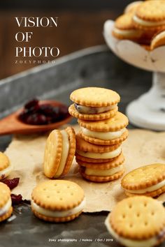 crackers stacked on top of each other in front of a plate with jams