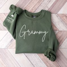 Grammy Sweatshirt, Grammy Sweater, New Grandma Shirt, Pregnancy Announcement, Grandma Shirt, New Grammy gift, Grandma Gift This cute Grandma Sweater is a dime a dozen! A sturdy and warm sweatshirt bound to keep you warm in the colder months. A pre-shrunk, classic fit sweater that's made with air-jet spun yarn for a soft feel and reduced pilling. The shirt is UNISEX and runs slightly large for ladies (for a relaxed fit, I'd suggest your usual size. For an oversized fit, consider sizing up 1 or 2 Sweatshirts For Grandma, Grandma Sweatshirt Ideas, Grammy Sweatshirt, Cute Grandma, Grammy Gift, Letter Sweatshirt, Custom Sweaters, Grandma Sweater, Grandma Shirt