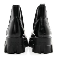 This is an authentic pair of PRADA Spazzolato Rois Womens Monolith Chelsea 55mm Ankle Boots size 39 in Black. These chic boots are crafted of smooth calfskin leather in black. They feature a rounded toe, elastic paneling for ease of wear, and black rubber platform soles. Chic Boots, Black Rubber, Calf Skin, Chelsea, Prada, Ankle Boots, Elastic, Boots, Leather