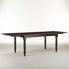 an old wooden table is shown against a white background with no one around it,