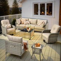 an outdoor living area with wicker furniture