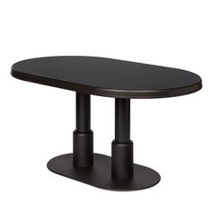 an oval table with two black pedestals