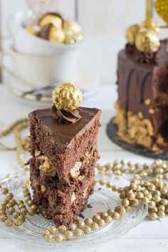 two pieces of chocolate cake with gold decorations