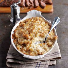 a casserole dish with meat and gravy in it on a table