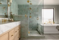 a bath room with a tub a sink and a mirror