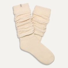 We take lounging VERY seriously, so trust us when we say the Clarice Tall Slouchy Sock is the "it girl" when it comes to comfy socks. Soft, dreamy, and super cozy, you can wear these pulled up to the knee or slouched down. Tall slouchy chenille sock 99% Polyester / 1% Elastane 18" height Soft twill tape with The UGG® Logo on top cuff Fits shoe size: 5-10 Imported Style #1161650 Cozy Snug Knee-high Socks, Cozy Soft Knee-high Socks, Cozy Comfortable Knee-high Socks For Stocking Stuffers, Cozy One Size Socks For Stocking Stuffer, Cozy Cotton Socks With Comfortable Fit, Comfortable Cozy Cotton Socks, Cozy Soft Socks One Size, Cozy Mid-calf Socks For Stocking Stuffers, Cozy Cream Soft Socks