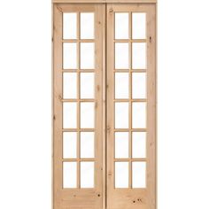 an unfinished wooden door with glass panels