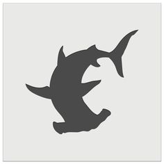 a black and white silhouette of a fish jumping up into the air with its mouth open