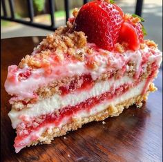 a piece of cake with strawberries on top