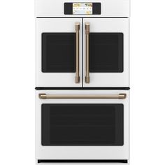 a white oven with two double doors and gold trimmings on the front, against a white background