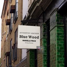 a sign on the side of a building that says blue wood marlbee price