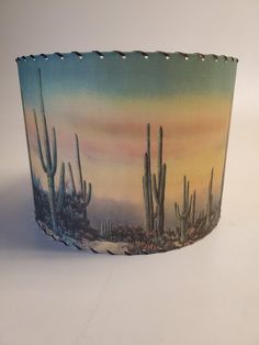 an image of a desert scene with cacti and cactus trees in the background