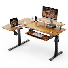 a computer desk with two computers on it