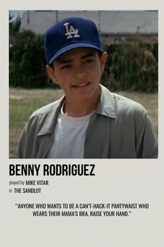 a young boy wearing a baseball cap and smiling at the camera with an ad in front of him