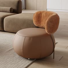 a modern living room with two couches and a round footstool in the middle