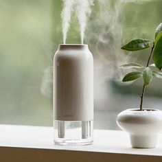 The compact Portable Humidifier H3X from Lumena makes traveling easier in dry climates. The double-hole design and updated tech use the 700ml reservoir to create a fine water mist that hydrates your environment and helps moisturize your skin, and its cylindrical shape tucks easily into your carry-on or hand luggage. Inspired by Chosun white porcelain, this humidifier boasts a glossy, durable glaze that repels liquids and enhances its elegant curves. It includes an independent LED mood lamp activ Humidifier Benefits, Mood Lamp, Portable Humidifier, Moma Design, Mood Lamps, Xmas Wishes, Water Mist, Dehumidifiers, Fall 24