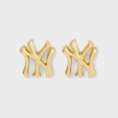 Elevate your game day style with the Bijoux Sport by Luv Aj MLB Logo Stud Earrings. Regardless of which team you’re rooting for, we’ve got the perfect pieces to help you show off your team spirit. These earrings features a sleek stud crafted from high-quality gold-plated brass, ensuring durability and a polished metal finish. The studs are adorned with an eye-catching logo charm of your favorite MLB team. High quality but also affordable, these pieces are built to endure much more than a nine-in Jewelery Earrings, New York Yankees Logo, Mlb Logo, Bone Earrings, Crawlers Earrings, Luv Aj, Hoop Earring Sets, Alter Ego, Pearl Stud Earrings