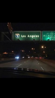 the freeway sign is lit up at night