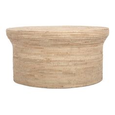 a large round wicker basket sitting on top of a white wall