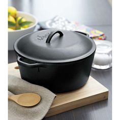 a cast iron skillet sitting on top of a cutting board