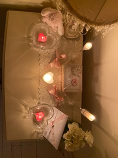 a table with candles and flowers on it