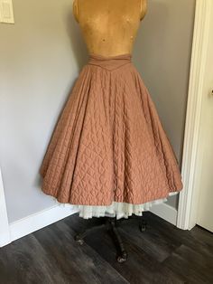 "1950's Vintage Quilted Circle Skirt in great condition. Unlined, metal zipper at back with two buttons.  Front waistband curves into a downwards point, very flattering. Small hole at inside waistband and broken thread ( see pictures for detail). Looks amazing over a crinoline. Size Vintage 13.  Very small waist. Measurements: Waist - 24\" Hip - Free Length from top of back waist band - 27\"" Vintage Circle Skirt, Vintage Full Skirt With Lining, Fitted Vintage Skirt For Vintage Fashion, Vintage Fitted Flared Skirt, Vintage Fashion Full Skirt, Vintage Flared Lined Skirt, Vintage High Waist Pleated Skirt, High-waist Vintage Pleated Skirt, 1950s Style Full Skirt With Lining