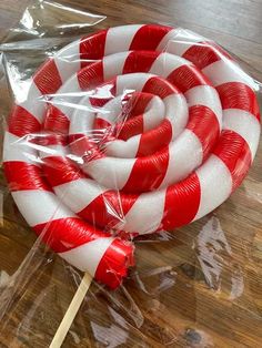 two lollipops wrapped in plastic on a table