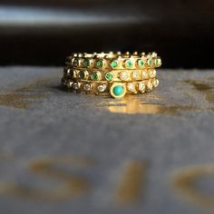 The Bohème Emerald Eternity End Stack ring is fabulous on its own, a great addition to your favorite stack, and perfect as a symbol of your everlasting love as a wedding or anniversary band. Hand carved, then cast in recycled 18k gold, each solid gold bead on this ring is bezel set with a 1.3 mm round emeralds. That's 24 emeralds in a size 6. Beads amount and total carat weight varies per size. This ring is flat and smooth on one side and lined with tiny beads on the other, making it a great way Crown Rings, Rings Hand, Columbian Emeralds, Geometric Textures, Tiny Beads, Stack Ring, Grain Of Sand, Half Eternity Ring, Anniversary Bands