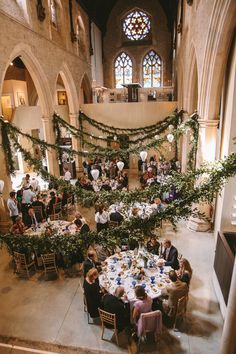 an overhead view of people sitting at tables in a church