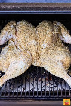 a whole chicken sitting on top of a grill