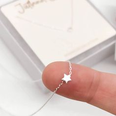 Your Tiny Silver Star Necklace Ships Today From Fort Collins, Colorado! This Dainty And Delicate Necklace Is Made With 100% Sterling Silver And Specifications: Dainty S925 Sterling Silver Star Necklace With Cable Chain. Bright Silver 2mm Cable Chain Necklace Length Is 14 Inches With An Additional 2 Inch Extender This Star Is Teeny Tiny! Jewelry Care Tips: Avoid Direct Contact With Perfumes, Body Lotions And Other Chemicals Remove Jewelry When Bathing, Showering Or Sleeping Store Jewelry In A Coo Silver Necklace Dainty, Star Print Jewelry As A Gift, Party Star Charm Necklaces, Silver Star-shaped Dainty Jewelry, Cheap Dainty Star Necklace, Dainty Sterling Silver Star Necklace, Jewelry Care Tips, Cheap Dainty Star-shaped Necklace, Star-shaped Tiny Necklace For Gift