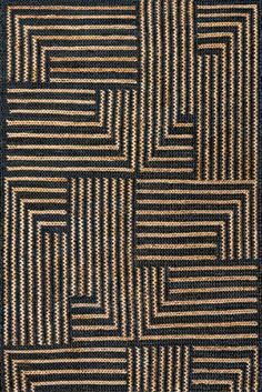 a black and brown rug with squares on it