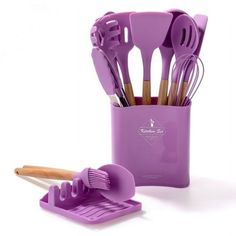 purple kitchen utensils and spatulas in a holder