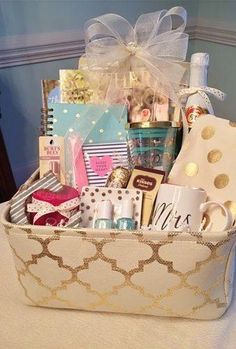 a basket filled with lots of different items on top of a white cloth covered table