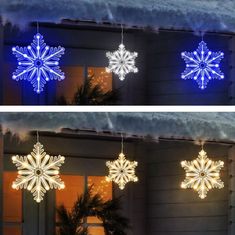 three snowflakes hanging from the side of a house