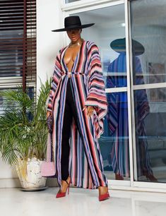 A woman posing in a multicolored chiffon fabric African kimono. Kimono Design, White Colors, Vertical Stripes, Clothing Ideas, Dinner Parties, Chiffon Fabric, Formal Occasion, Evening Wear, Fabric Care