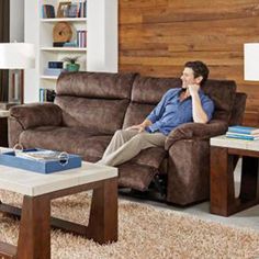 a man sitting on a couch in a living room