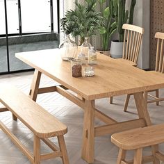 a wooden table with two chairs and a bench in front of it on tile flooring