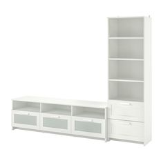 a white bookcase with drawers and shelves