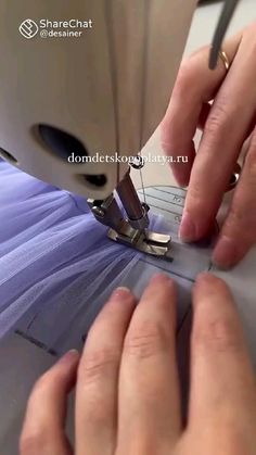 someone is using a sewing machine to sew something