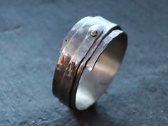 Sterling silver ring that has been gently hammered, coiled, and secured with a tiny 9k gold rivet. Riveted Ring, Pebble Ring, Lovely Ring, Rivets, Silver Band, Beautiful Bracelet, Sterling Silver Ring, Band Rings, Favorite Jewelry