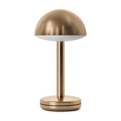 a gold table lamp on a white background